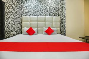 Postel nebo postele na pokoji v ubytování Hotel O K10