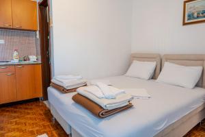 Postel nebo postele na pokoji v ubytování Guest House Vucicevic