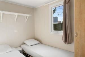 Postel nebo postele na pokoji v ubytování Camping Roseto degli Abruzzi