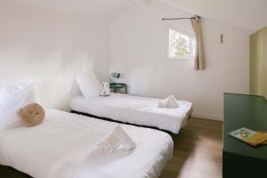 Slow Village Biscarrosse Lac客房内的一张或多张床位