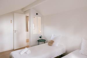 Slow Village Biscarrosse Lac客房内的一张或多张床位