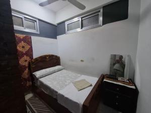 Un pat sau paturi într-o cameră la david hostel