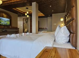 Postel nebo postele na pokoji v ubytování Hotel Golden Orchid