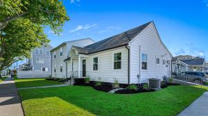 a white house with a black roof at 1811 Atlantic Ave, Unit 2 in Wildwood