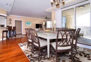 a kitchen and dining room with a table and chairs at Residence 810 At The Grand in Wildwood