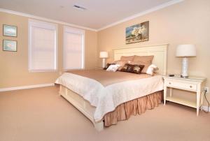 a bedroom with a large bed and a window at Residence 810 At The Grand in Wildwood +24 photos