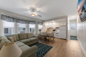 a living room with a couch and a kitchen at 5605 Seaview Ave, Unit G in Wildwood