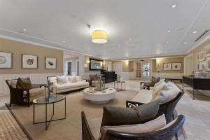 a large living room with couches and chairs at Residence 306 At The Grand in Wildwood