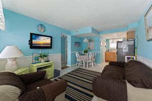 a living room with a couch and a kitchen at 7203 Atlantic Ave, Unit 101 in Wildwood Crest