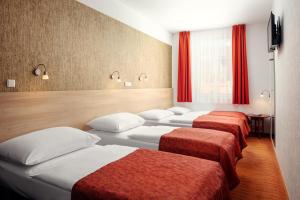 Postel nebo postele na pokoji v ubytování Hotel Ambiance