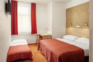Postel nebo postele na pokoji v ubytování Hotel Ambiance