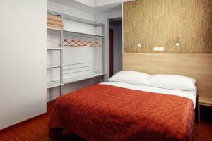 Postel nebo postele na pokoji v ubytování Hotel Ambiance