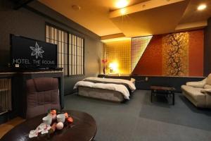 Postel nebo postele na pokoji v ubytování HOTEL the ROOMS - Couple's Hotel