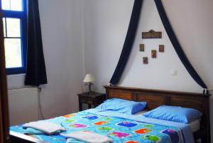 Llit o llits en una habitació de Archondissa Beach Aparthotel