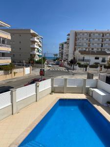 a swimming pool on the balcony of a building at House 50meters from the beach in Cunit