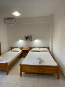 A bed or beds in a room at Manos Kritikakis Apartments