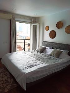 Postel nebo postele na pokoji v ubytování Cassia Riverside Villa