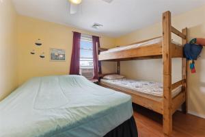 a bedroom with two bunk beds in a room at 234 W 1St Ave in North Wildwood