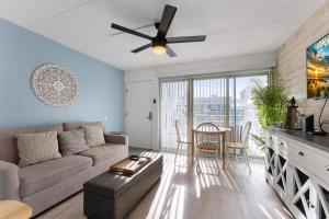 a living room with a couch and a table at 301 Ocean Ave, Unit 102 - The Harbor Light in North Wildwood