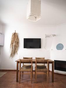 a dining room with a table and two chairs at Casa Augustin, village house in Mojacar Pueblo in Mojácar