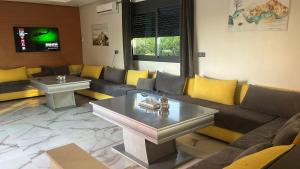 A seating area at Villa Berkania piscine privée - 8 pers