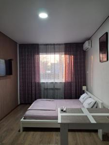 Postel nebo postele na pokoji v ubytování Гостиничный комплекс SIESTA