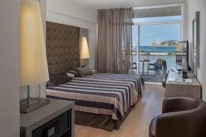 Posteľ alebo postele v izbe v ubytovaní Hotel Panorama