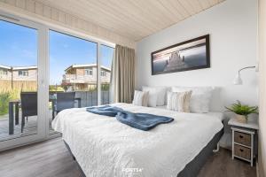 En eller flere senge i et værelse på Ferienhaus Seepferdchen Marina Wendtorf