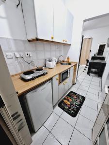 Η κουζίνα ή μικρή κουζίνα στο Lovely Paceville Studio C