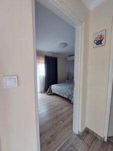 Postel nebo postele na pokoji v ubytování Laurus Vendéghàz