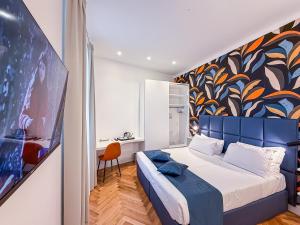 A bed or beds in a room at Albergo Abruzzi