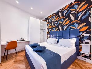 A bed or beds in a room at Albergo Abruzzi