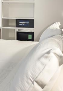 A bed or beds in a room at Albergo Abruzzi