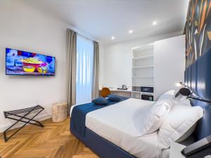 A bed or beds in a room at Albergo Abruzzi