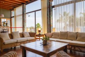 a living room with couches and a coffee table at Best Western Hotel Santa Caterina in Acireale