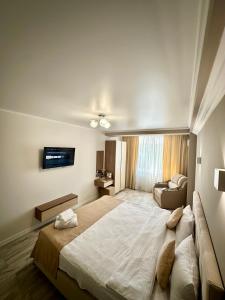 Postel nebo postele na pokoji v ubytování Hotel Paris