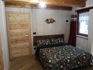 Postel nebo postele na pokoji v ubytování I Rododendri