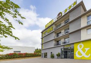 a rendering of the front of the hotel at B&B HOTEL Perpignan Saleilles in Perpignan