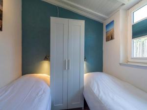 Ένα ή περισσότερα κρεβάτια σε δωμάτιο στο Beachside holiday home