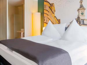 Voodi või voodid majutusasutuse B&B Hotel Aalen toas