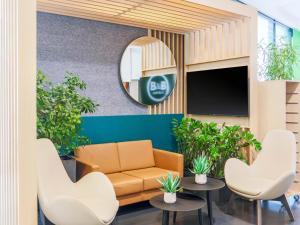 Televiisor ja/või meelelahutuskeskus majutusasutuses B&B Hotel Aalen
