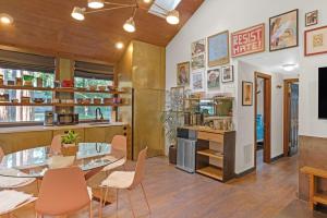 a dining room and kitchen with a table and chairs at Artsy Retreat - Woodstove Grill and Patio in Guerneville +25 photos