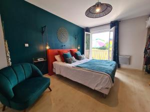 a bedroom with a bed and a chair and a window at Maison familiale à la campagne in Alby +4 photos