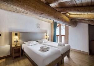 Postel nebo postele na pokoji v ubytování Chalet Charline