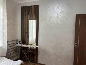 a dressing room with a mirror and a table at DS Appartment in Yerevan in Yerevan