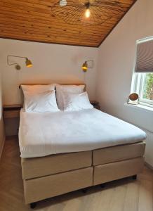 Postel nebo postele na pokoji v ubytování Hotel de Baak Seaside