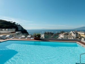 a swimming pool on the roof of a building at Hotel Tirrenia in Sorrento