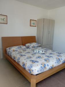 Postel nebo postele na pokoji v ubytování Stanze nel verde