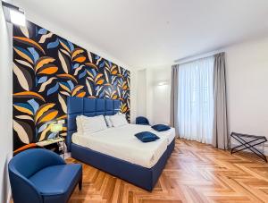 A bed or beds in a room at Albergo Abruzzi