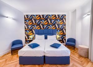 A bed or beds in a room at Albergo Abruzzi